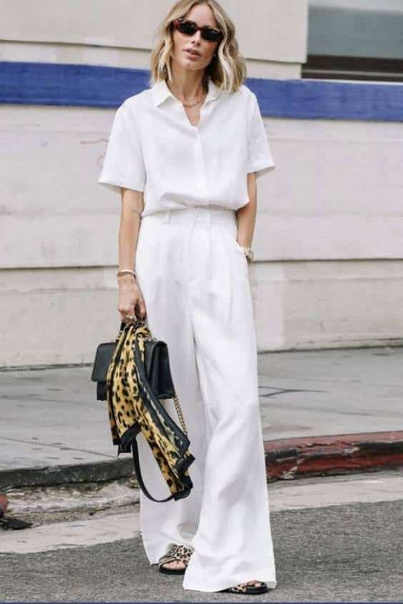 all white outfits - white short sleeve button up - white pleated trousers - wide leg trouser - animal print accessories